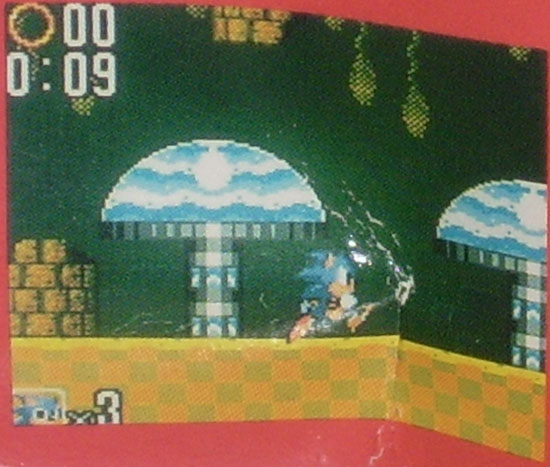 Checkerboard floor and different palette for being underwater within Act 2. This appears to be near the start of the level. Found on the box of a US Sonic 2 Game Gear bundle.