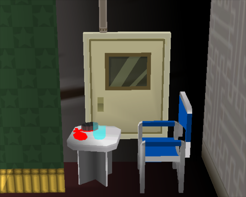 The left side of the stage has a chair, control panel, and table. On the table is a transparent container that gets more transparent the further the camera is zoomed out, along with a hairbrush and a mirror.