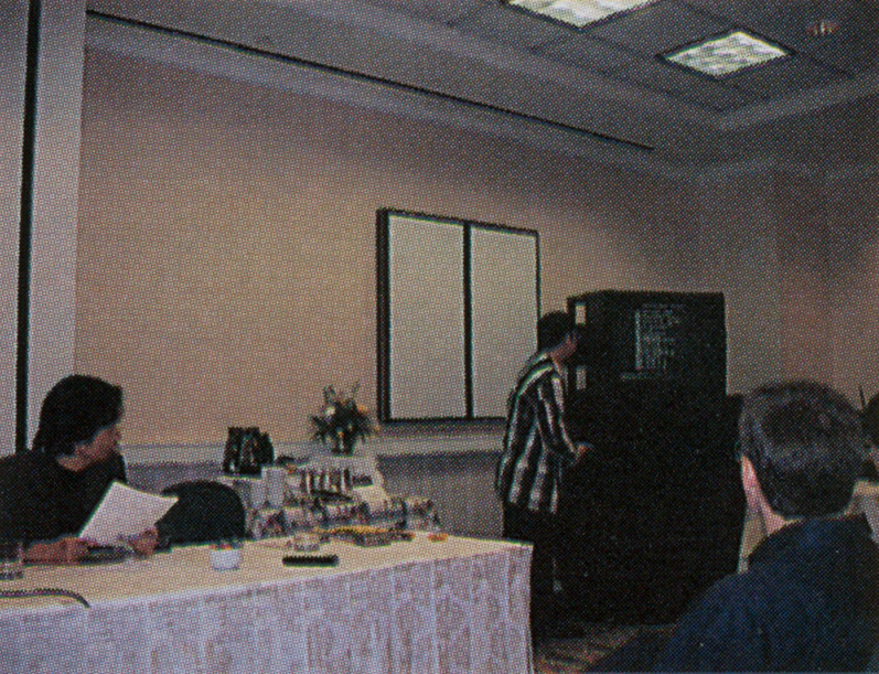 Takashi_Tezuka_at_E3_1998_Press_Conference_(64Dream_1998-08).png