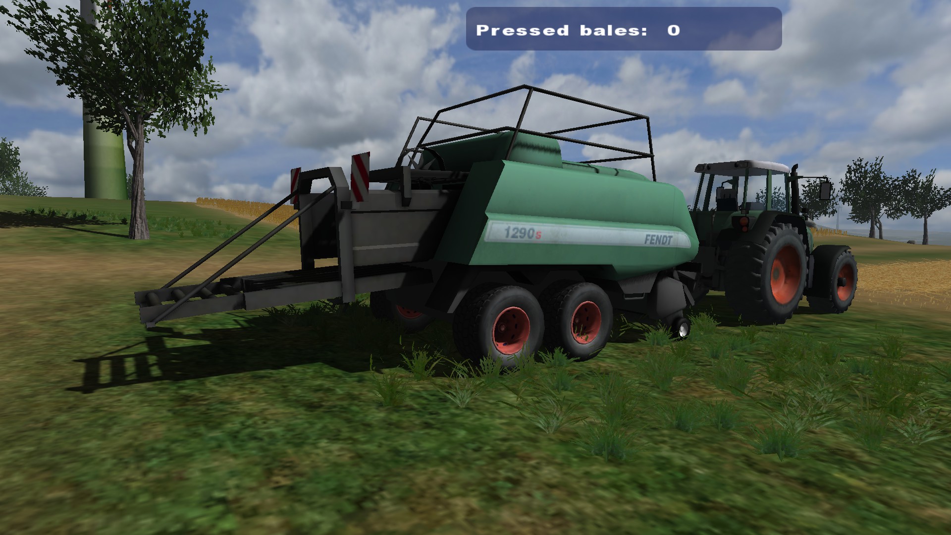 The baler with red rims.