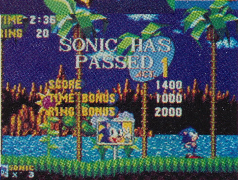 This picture of the end of Act 1 indicates that the background was set lower in at least one build. A strip of lighter blue can be seen above the rightmost palm tree as a result of this.