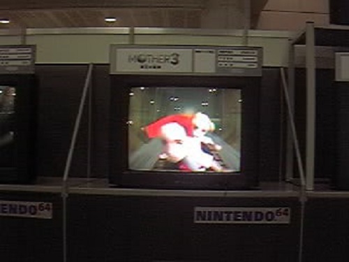 A close-up of Claus and Lucas facing forward in the minecart. As described by a few who went to the event, they were "expressionless", as seen here.