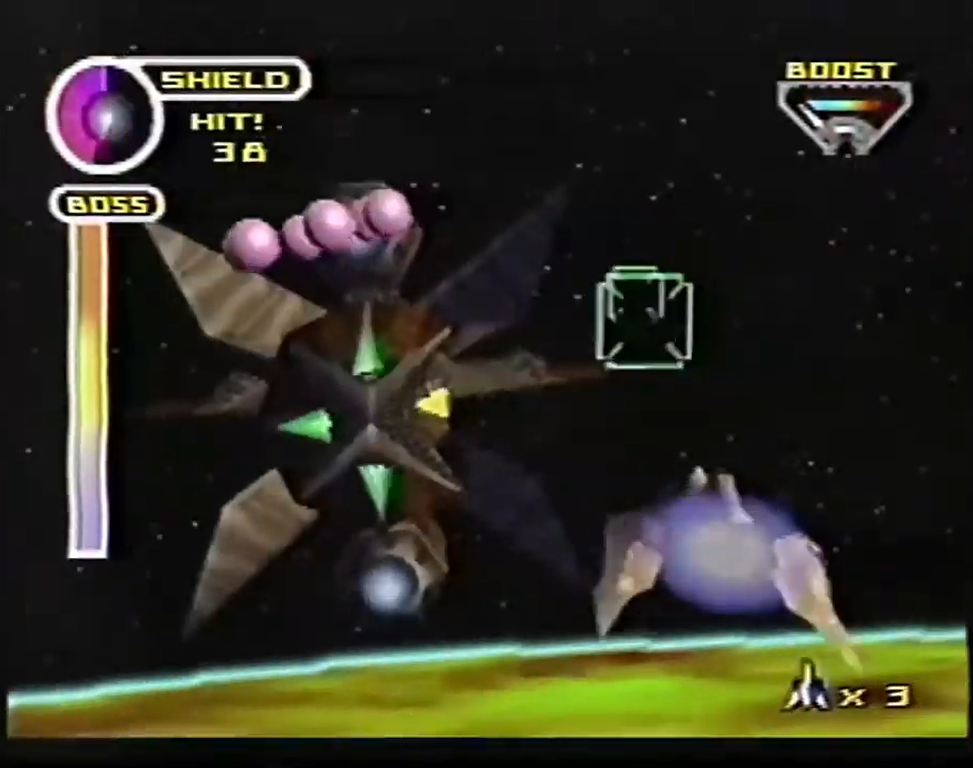 The player barrel-rolls and dodges the pink balls, making them seem like an attack.