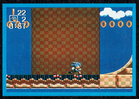 Sonic's design here is consistent with the May 17 Game Gear build. The HUD has the rings on the top with the time on the bottom. The area seen here in Turquoise Hill Zone also looks quite different than the final.