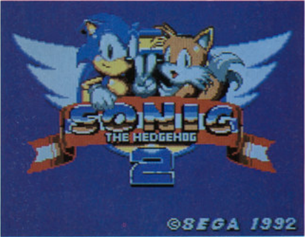 The Game Gear title screen with rearranged copyright info and no ™ symbol. Sonic's waving hand and Tails' winking eye appear to have more detail here. This can be seen in the final when viewing those graphics with the background palette line, which might mean those graphics are part of the background here and don't animate similar to what is seen in the Shinsaku footage. BeepMD JP 1992-12