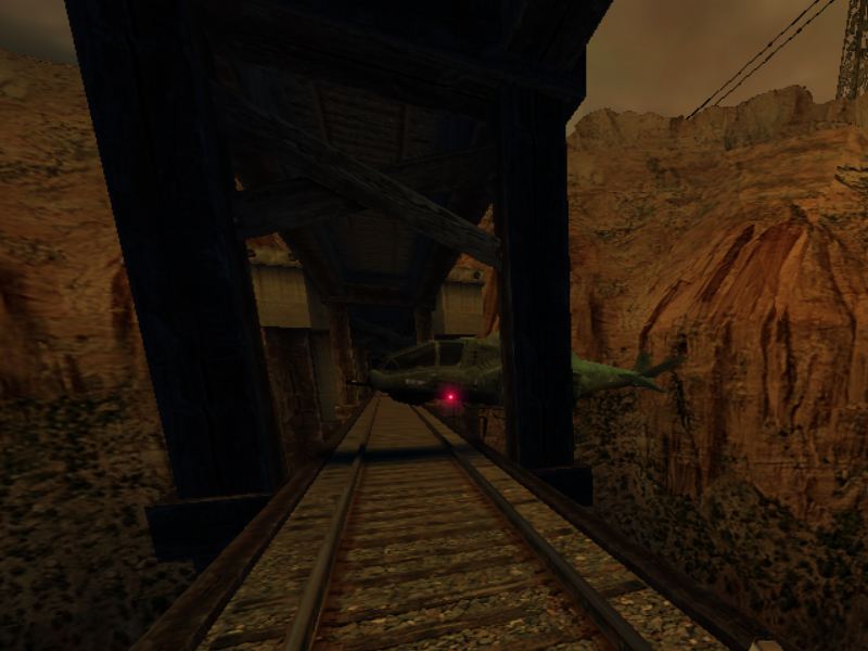 The helicopter flying over the tracks, slightly clipping with them.