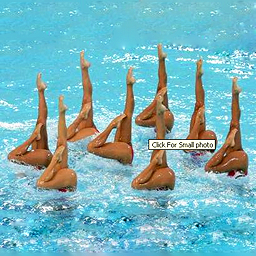 Michael Cole's selection picture, which consists of a photo of synchronized swimmers(?), with a small textbox saying "Click For Small Photo" taken from the file explorer of Windows XP Michael Cole's selection picture, which consists of a photo of synchronized swimmers(?), with a small textbox saying "Click For Small Photo" taken from the file explorer of Windows XP