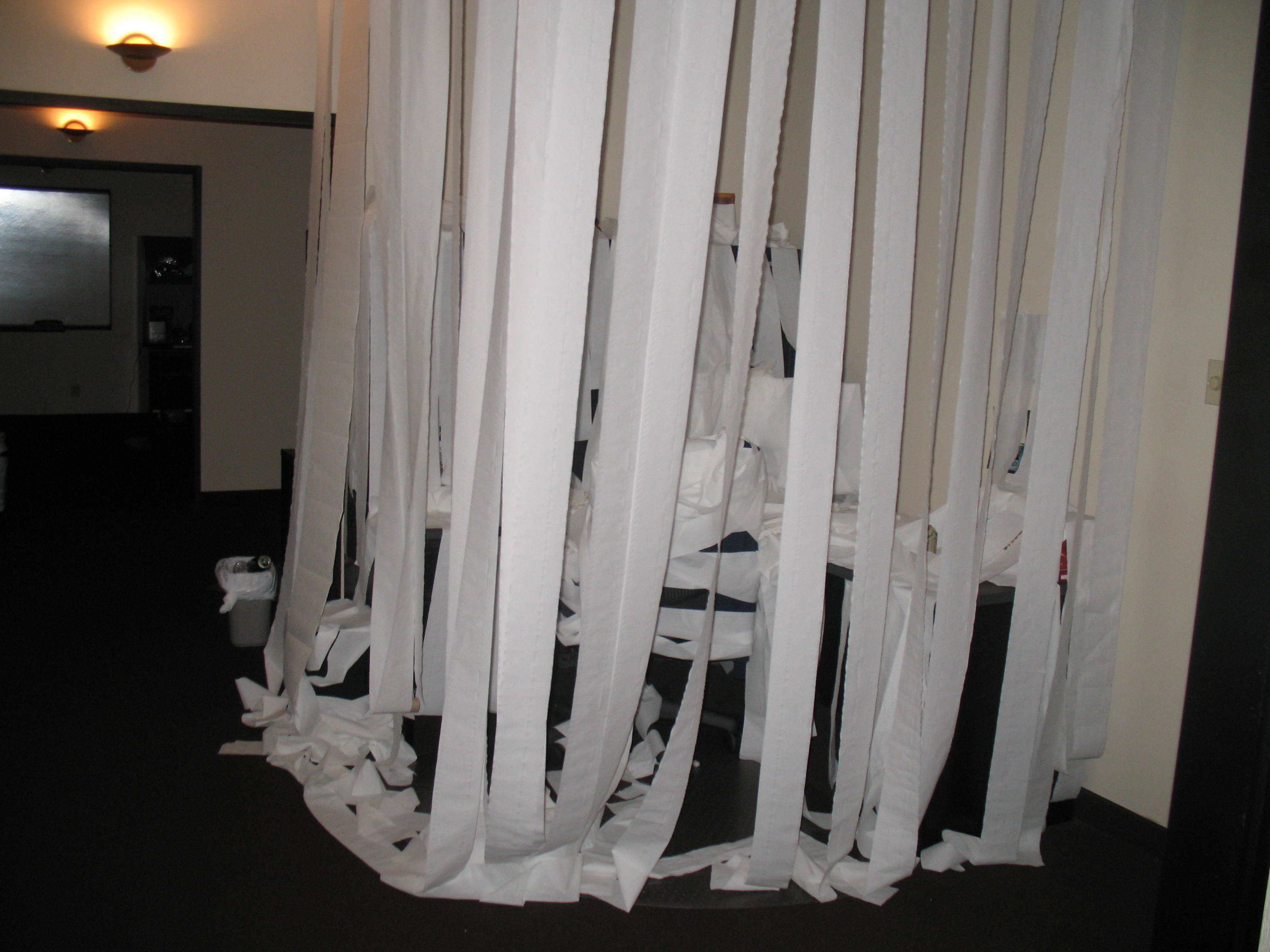 The desk of a developer covered in toilet paper. The desk of a developer covered in toilet paper.