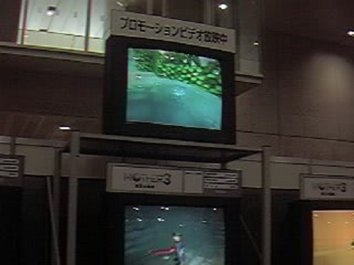 On the top TV, we see the Clayman rising out of the lake from the trailer. Below, Flint is attacked by a poisonous snake, which many mistook for worms! On the right, a little bit of the desert area can be seen.