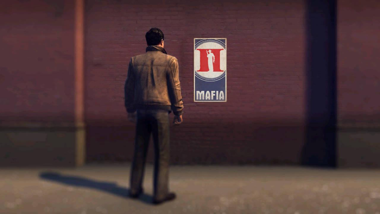 MIP DEMO end.png depicts Vito in the Leather Jacket outfit, facing a brick wall poster featuring the game's icon.