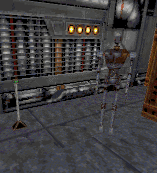 The droid pictured is 8t88 from Star Wars: Jedi Knight, and would be replaced by an assassin droid for the final game. The object to the left is unknown, and is positioned where the data crystal would be.